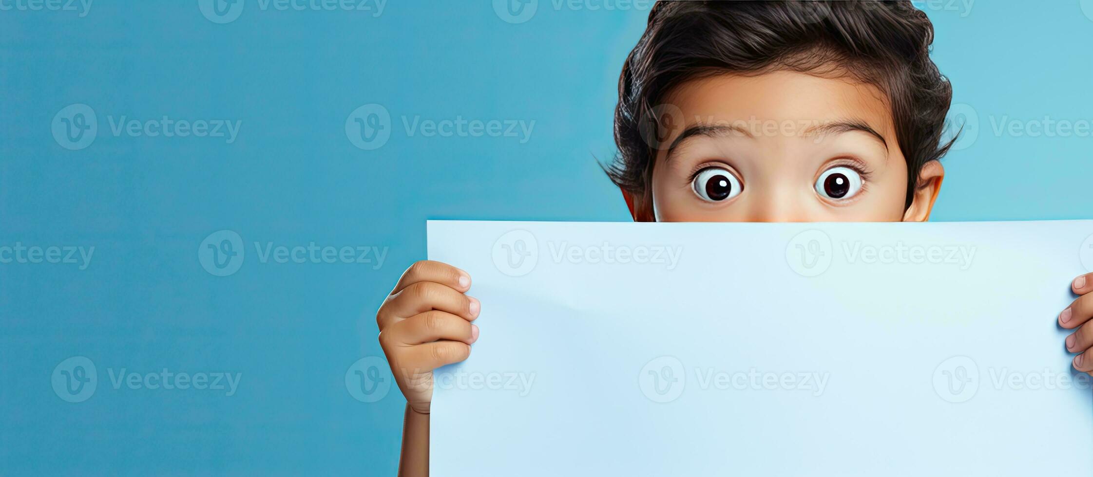 child behind blue paper finger pointing copy space for ad photo