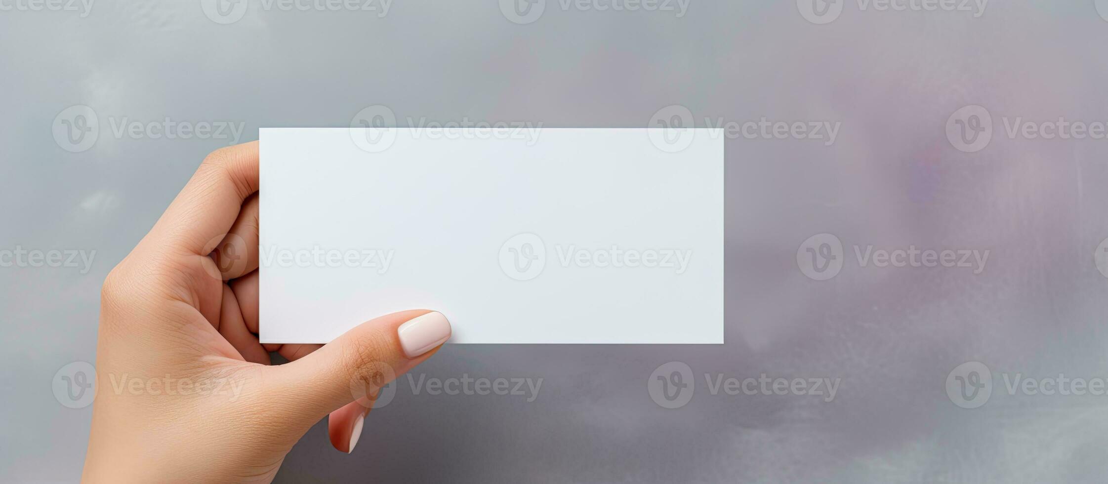 Caucasian woman with business card on grey background photo