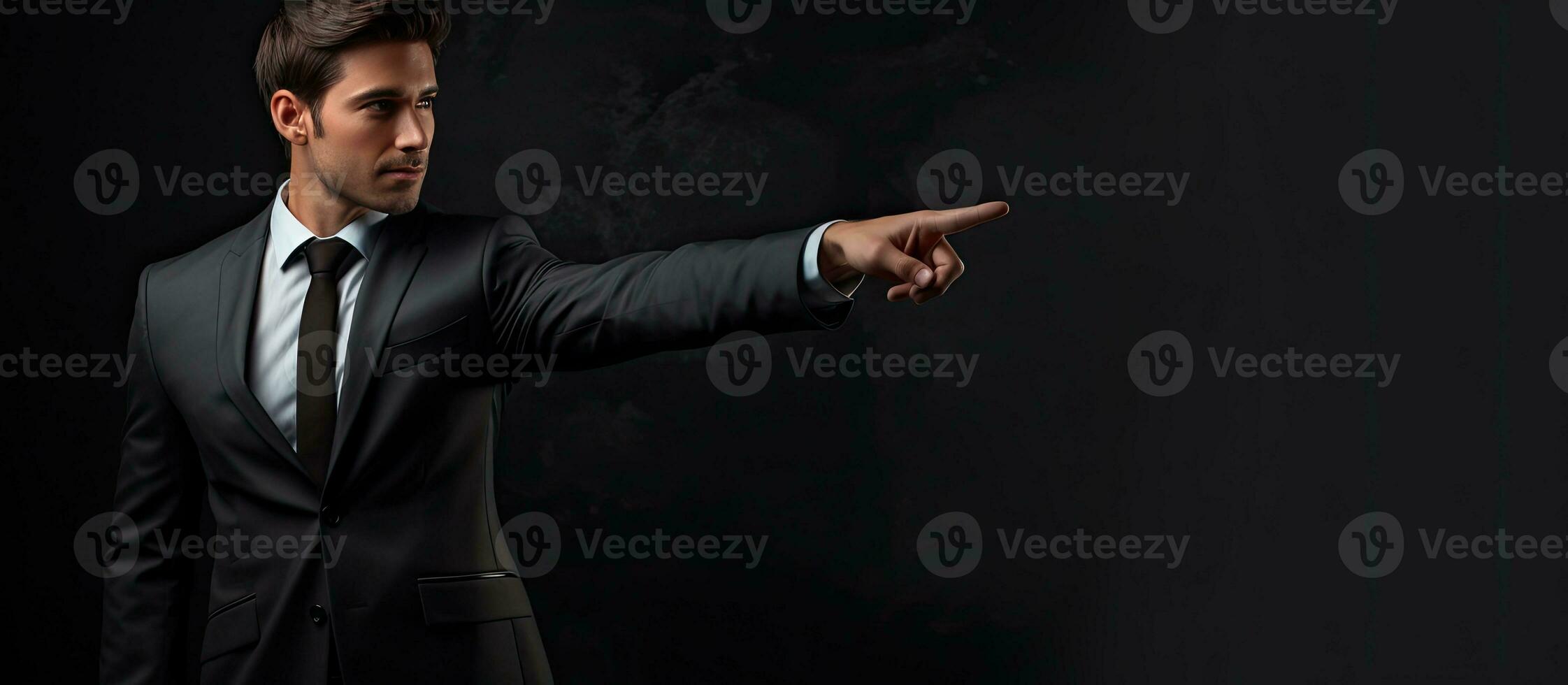 business person indicating or gesturing towards empty area photo