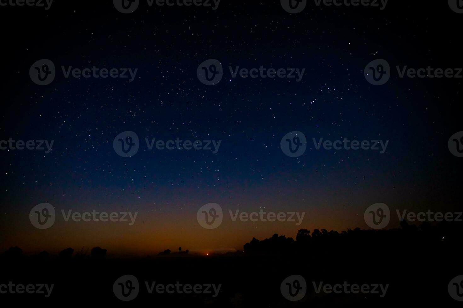Night scenery with colorful and light yellow Milky Way Full of stars in the sky. photo