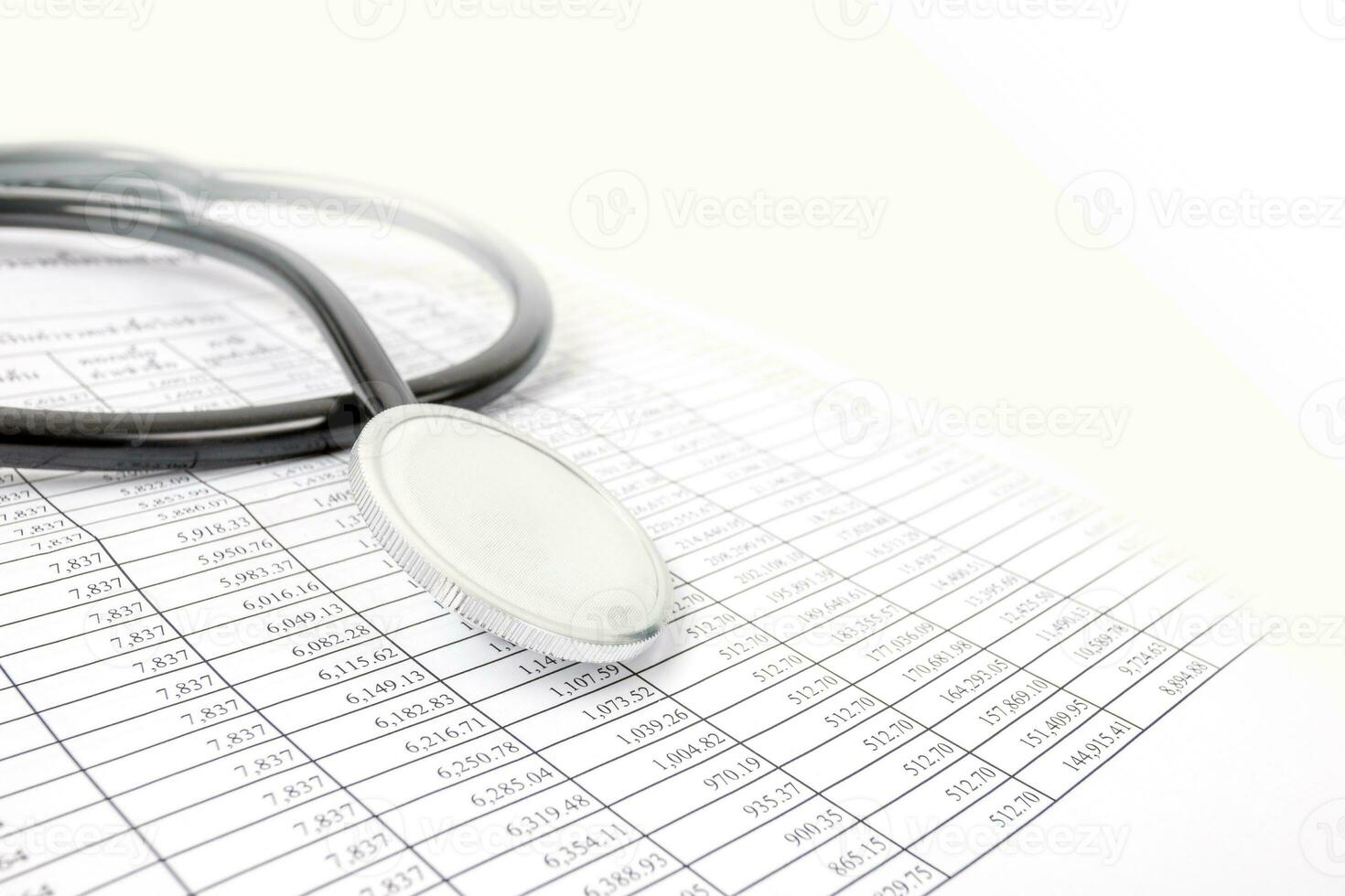 Financial Health Concepts, Financial Numbers Table and Doctor Stethoscope photo