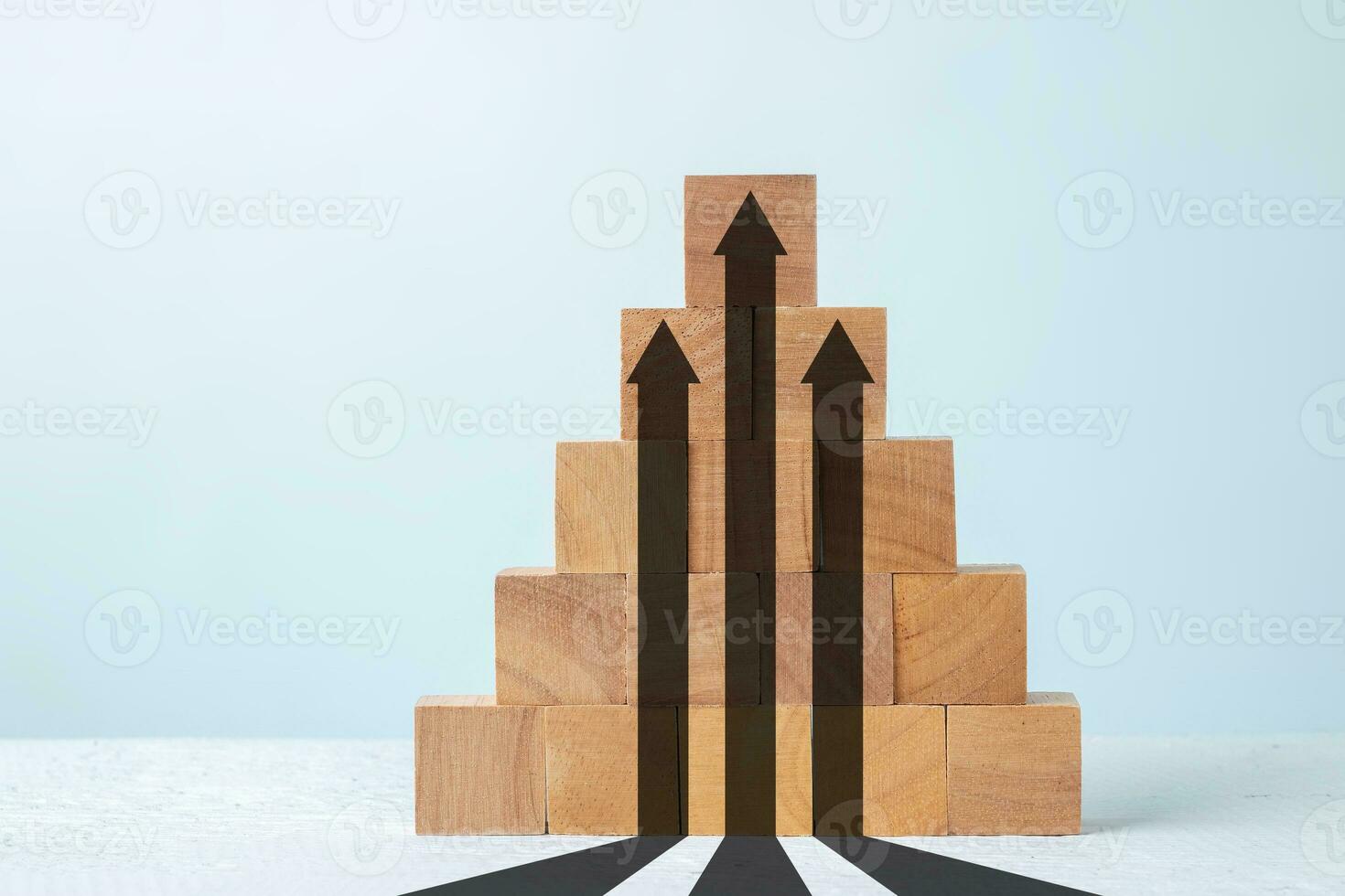 Up arrow on wooden block , Growth concept. photo