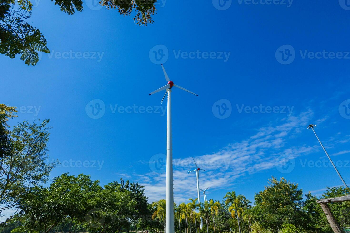 Environmentally friendly wind turbines in the park photo