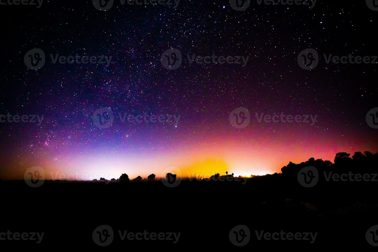 Night scenery with colorful and light yellow Milky Way Full of stars in the sky. photo