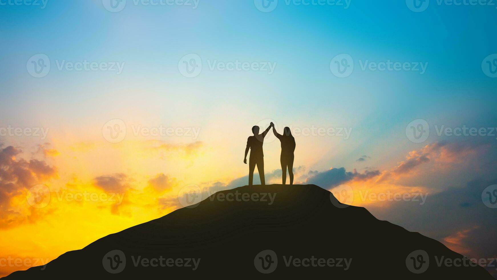 Teamwork and success concept, Silhouette of business people on the top of the hill photo