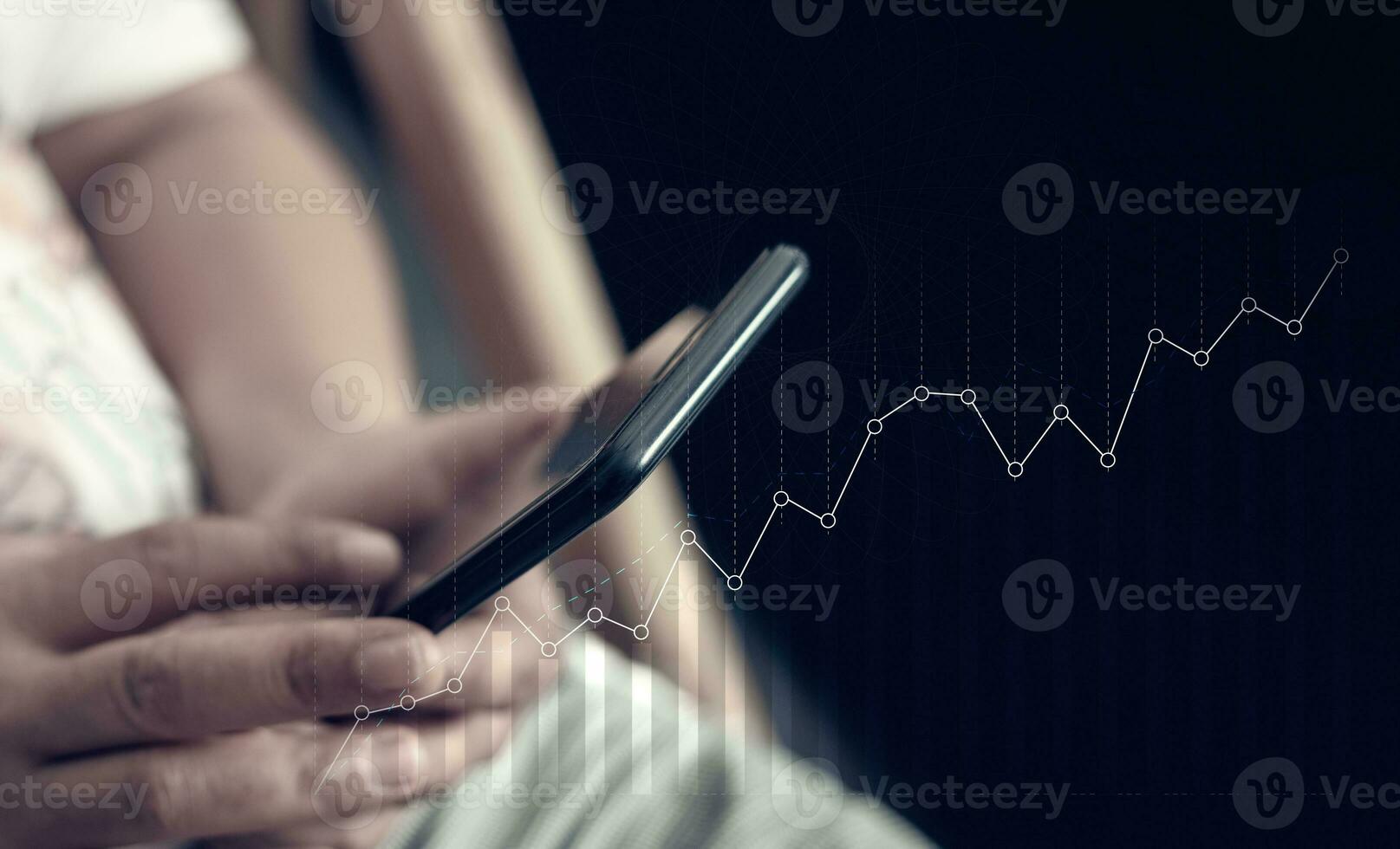 A person resting at home using the phone to do work photo