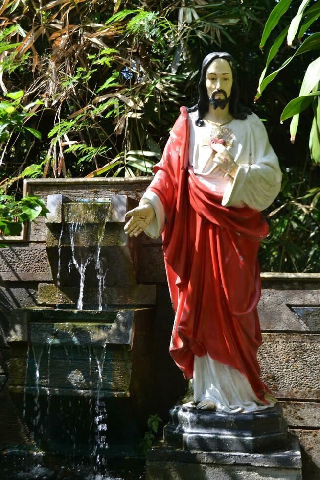 Statue of Lord Jesus, face of mercy, symbol of Catholic religion, place to pray, give thanks for God's grace photo