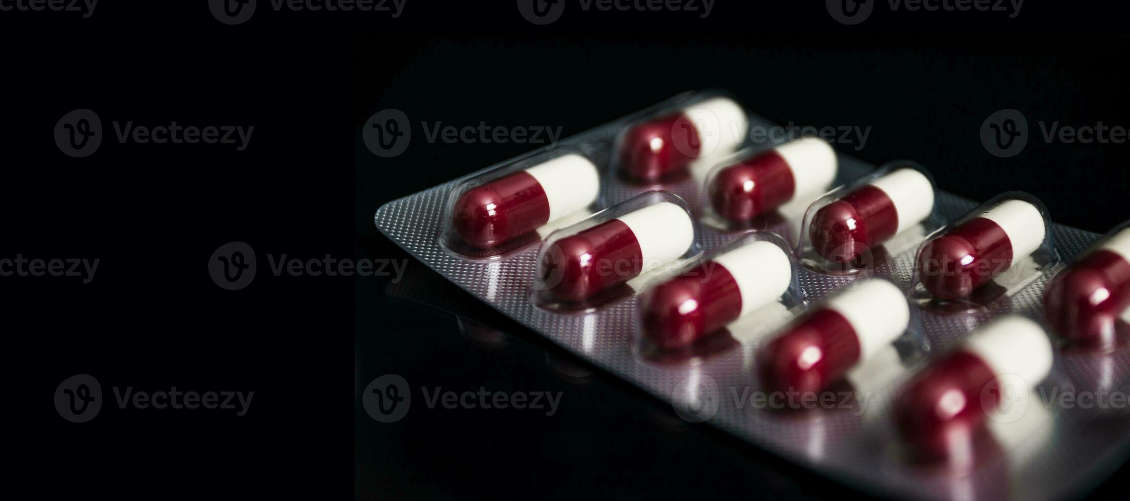 Medical concept, Drug capsule for treatment on black background. photo