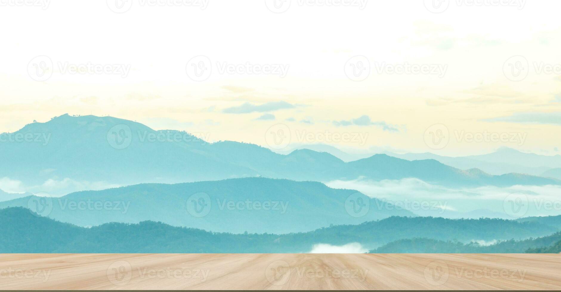 Wooden table with Mountain range background. photo