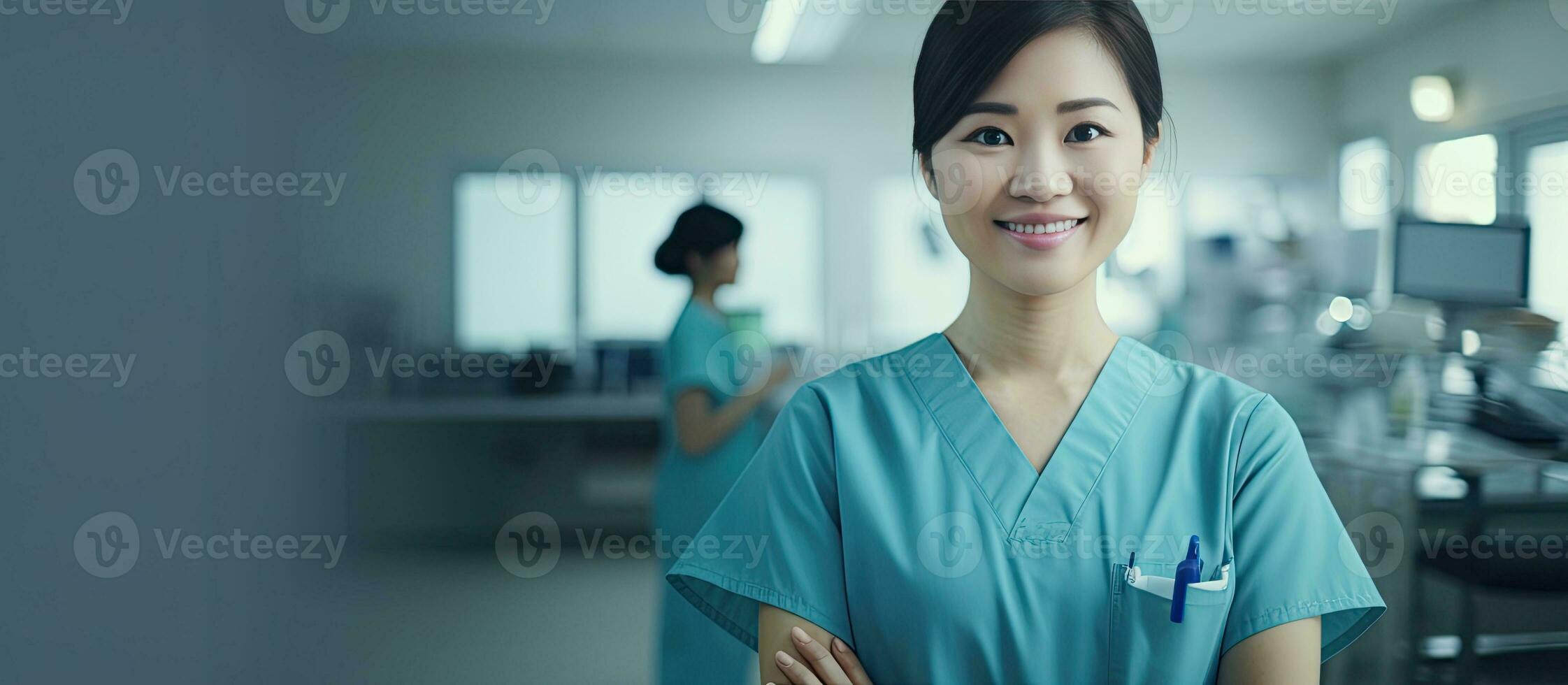 Female Thai surgeon in blue uniform with stethoscope standing smartly in operating room smiling at the camera with a friendly demeanor with copy space ava photo