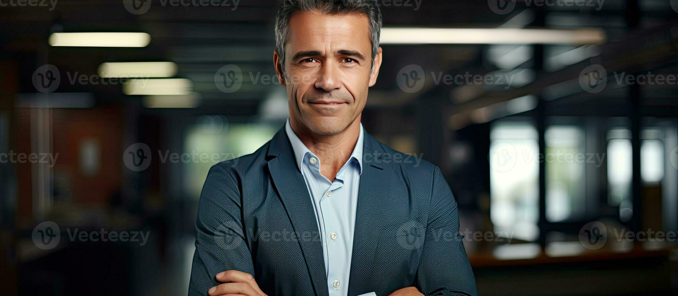 Confident mature leader businessman smiling at the camera with office background photo