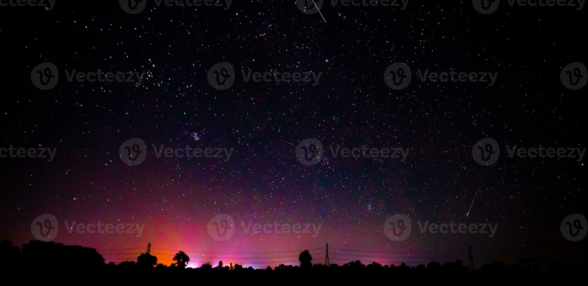 Night scenery with colorful and light yellow Milky Way Full of stars in the sky. photo