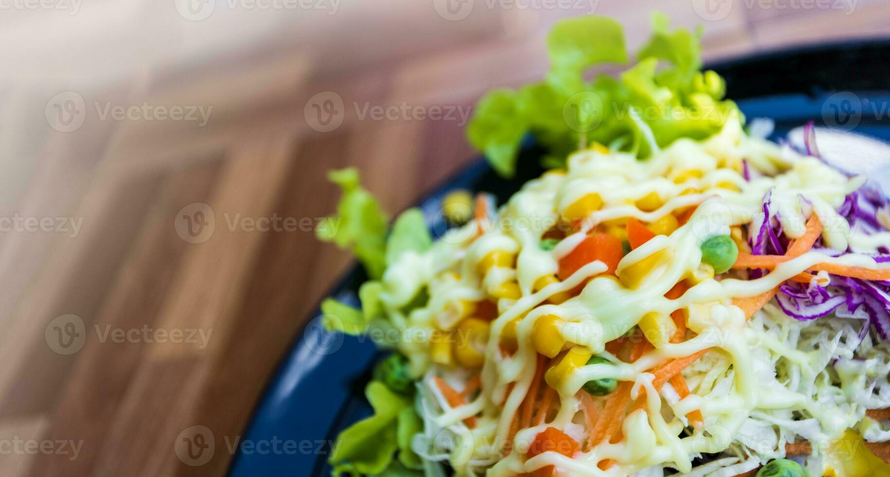 Healthy food vegetable salad on black plate photo