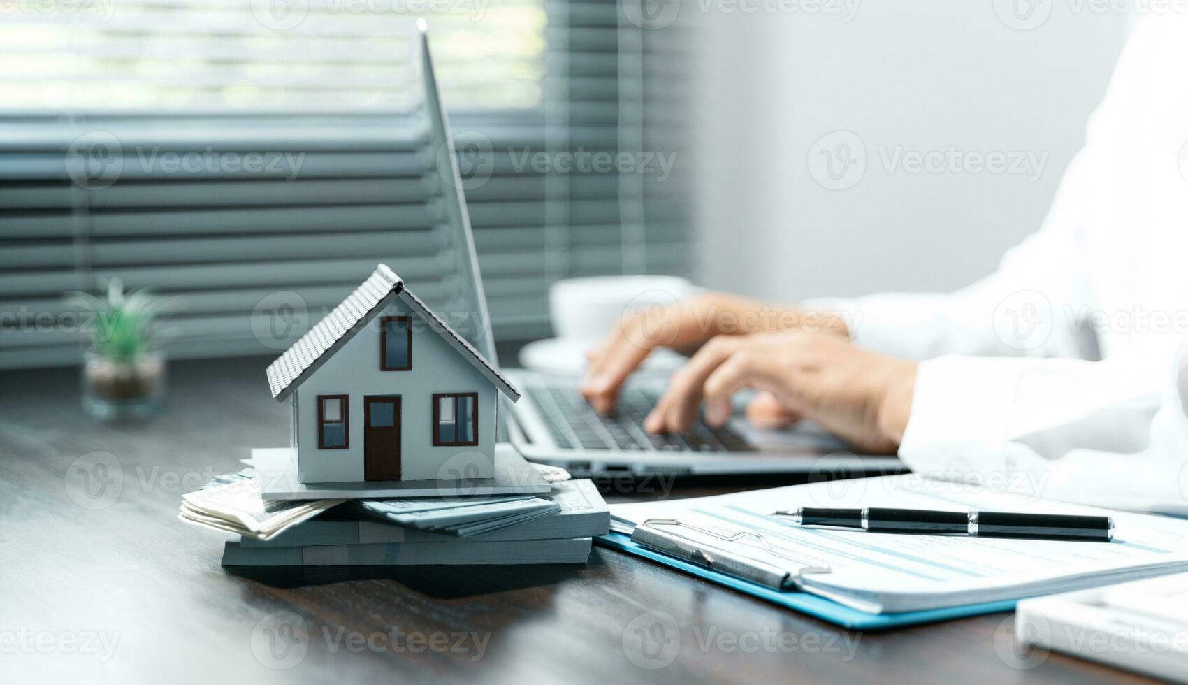 Single family house, concept of real estate, Sales manager or real estate agent prepares to hand over the keys and the house together with the insurance to the customer. photo