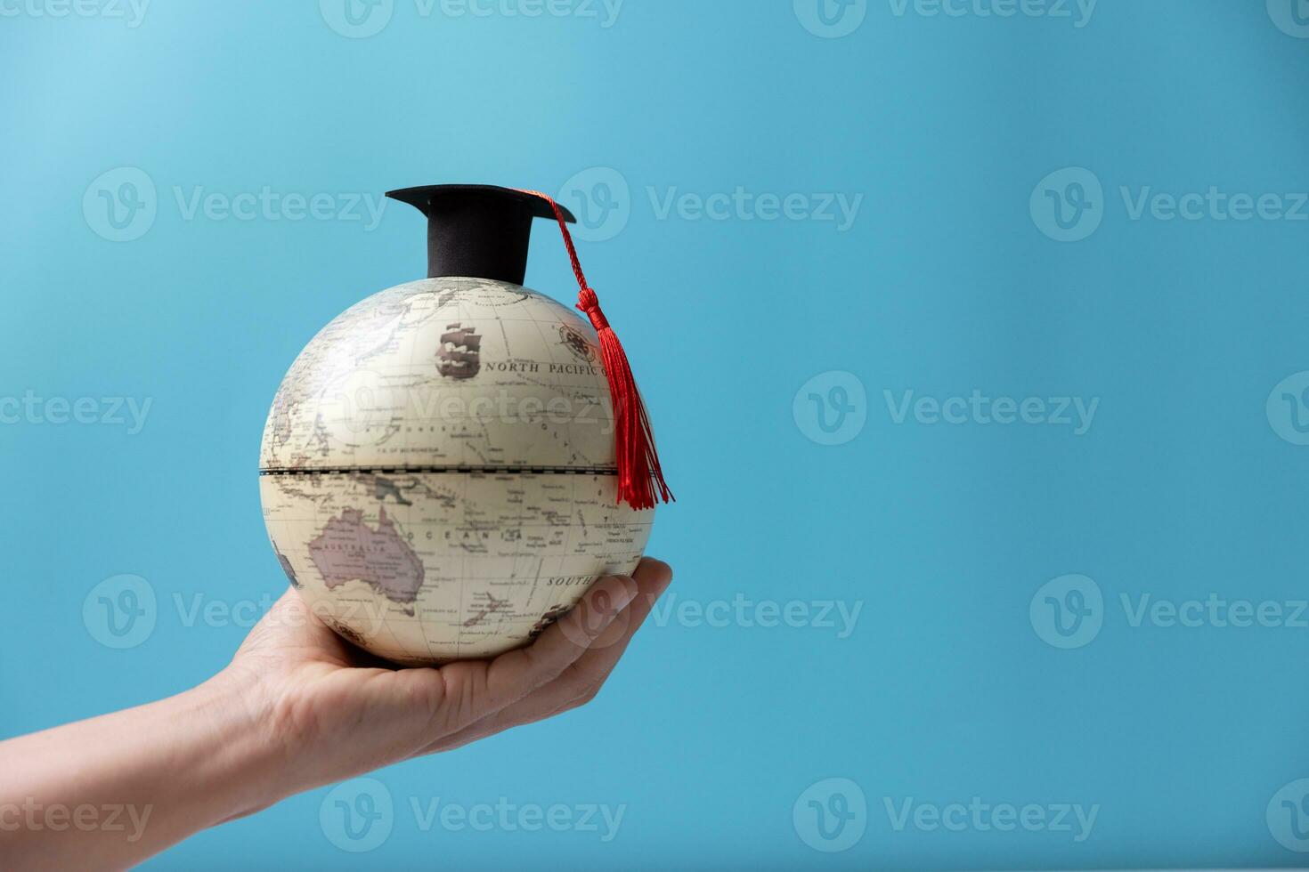 Graduation cap with Earth globe. Concept of global business study, abroad educational, Back to School, Study abroad business in universities. Elements of this image furnished by NASA. photo