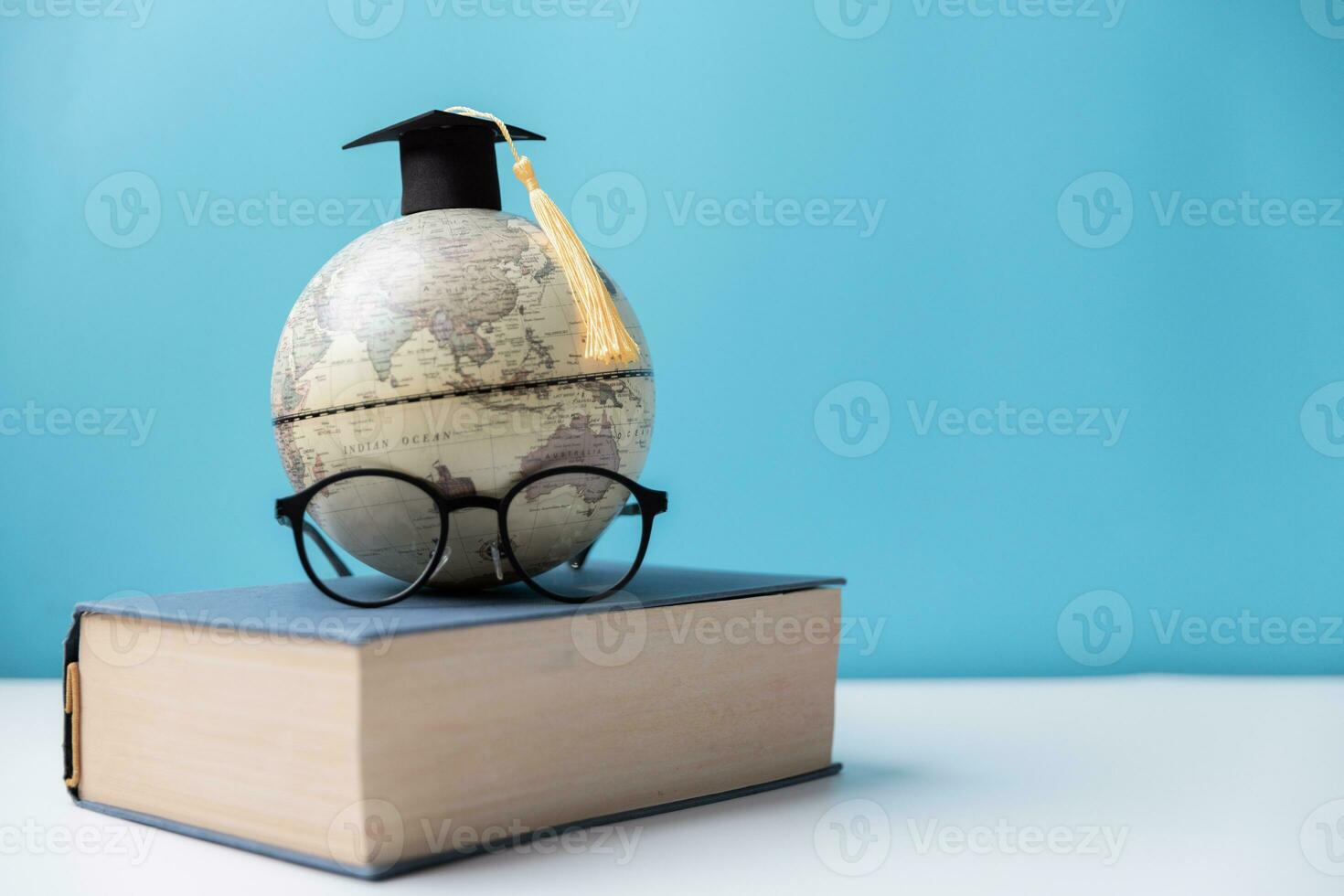 Graduation cap with Earth globe. Concept of global business study, abroad educational, Back to School, Study abroad business in universities. Elements of this image furnished by NASA. photo
