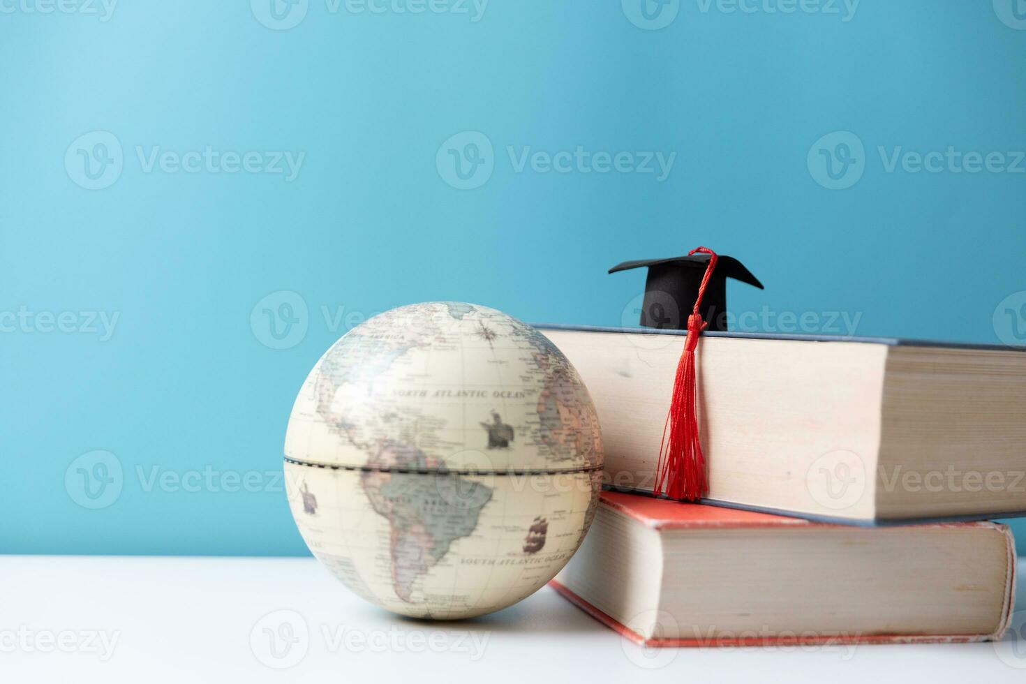 Graduation cap with Earth globe. Concept of global business study, abroad educational, Back to School, Study abroad business in universities. Elements of this image furnished by NASA. photo