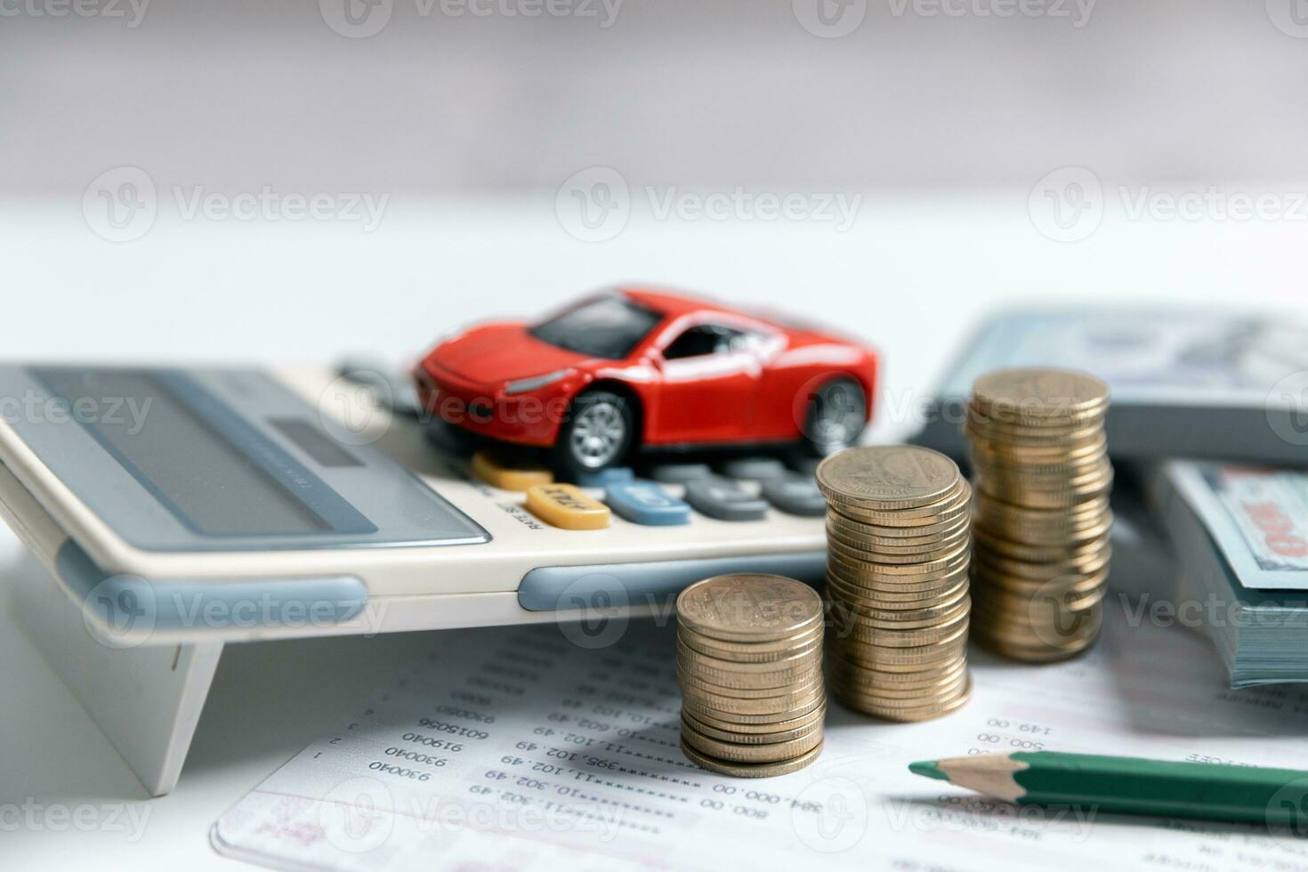 Signing a contract for the purchase of a new car, money cash, car, and car key on a contract agreement documents. Car, coins and calculator with copy space. photo