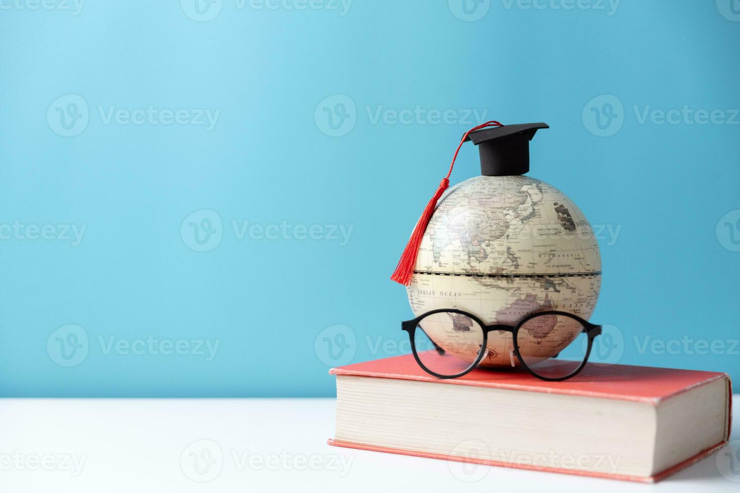 Graduation cap with Earth globe. Concept of global business study, abroad educational, Back to School, Study abroad business in universities. Elements of this image furnished by NASA. photo