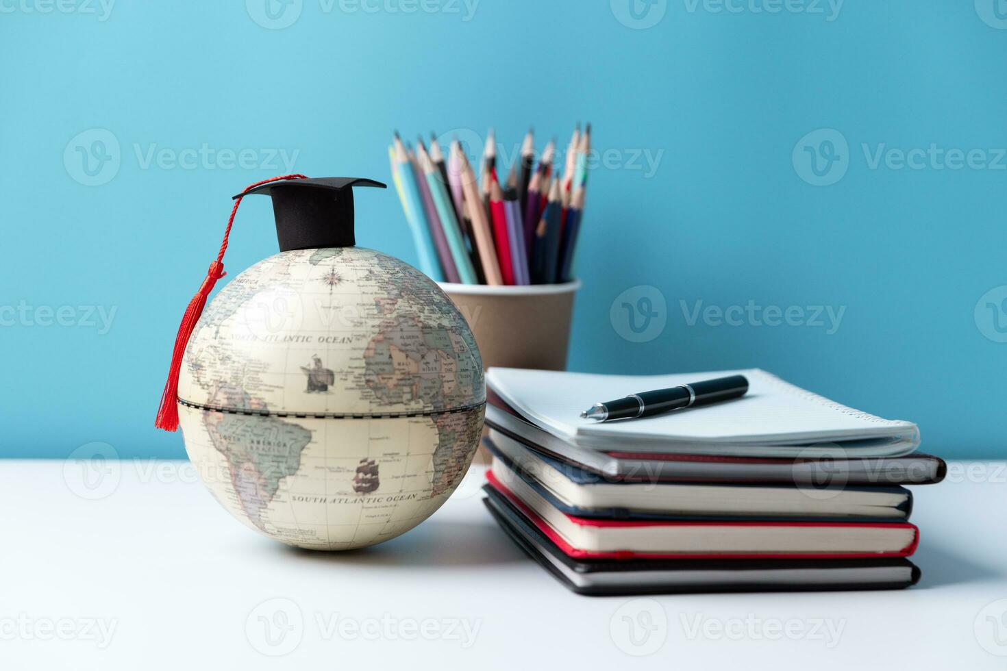 Graduation cap with Earth globe. Concept of global business study, abroad educational, Back to School, Study abroad business in universities. Elements of this image furnished by NASA. photo