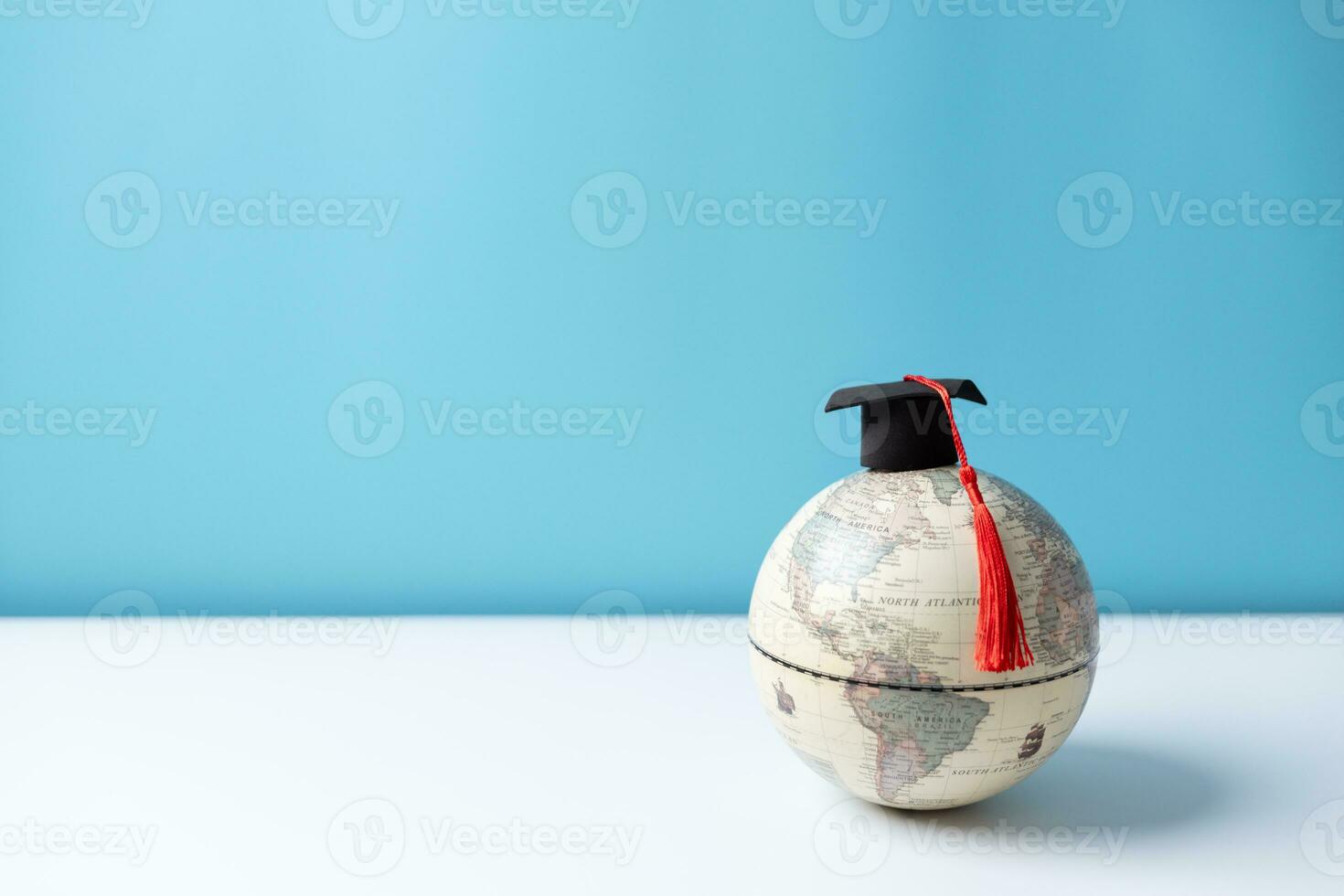 Graduation cap with Earth globe. Concept of global business study, abroad educational, Back to School, Study abroad business in universities. Elements of this image furnished by NASA. photo