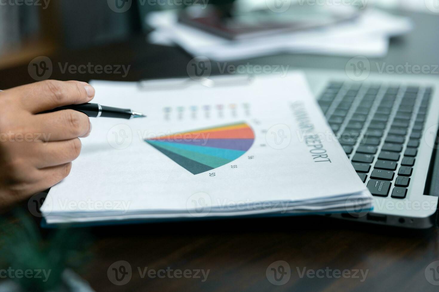 Businesswomen working to analyze, work together to discuss company financial statistics, brainstorm ideas, and graph documents on the table. photo