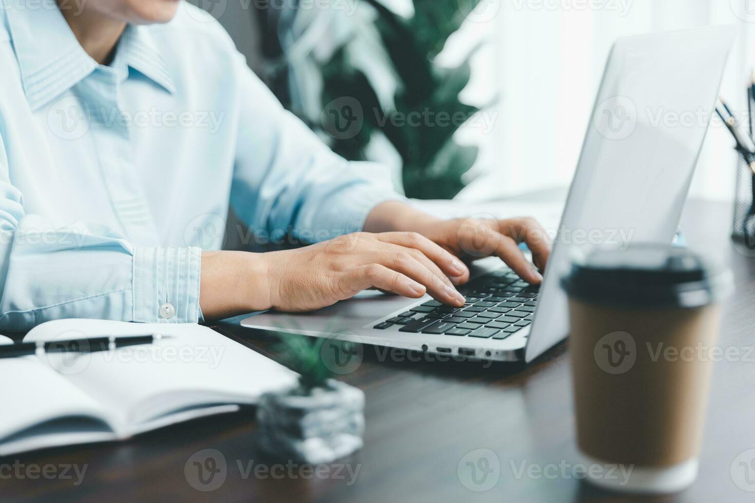 Businesswomen working to analyze, work together to discuss company financial statistics, brainstorm ideas, and graph documents on the table. photo