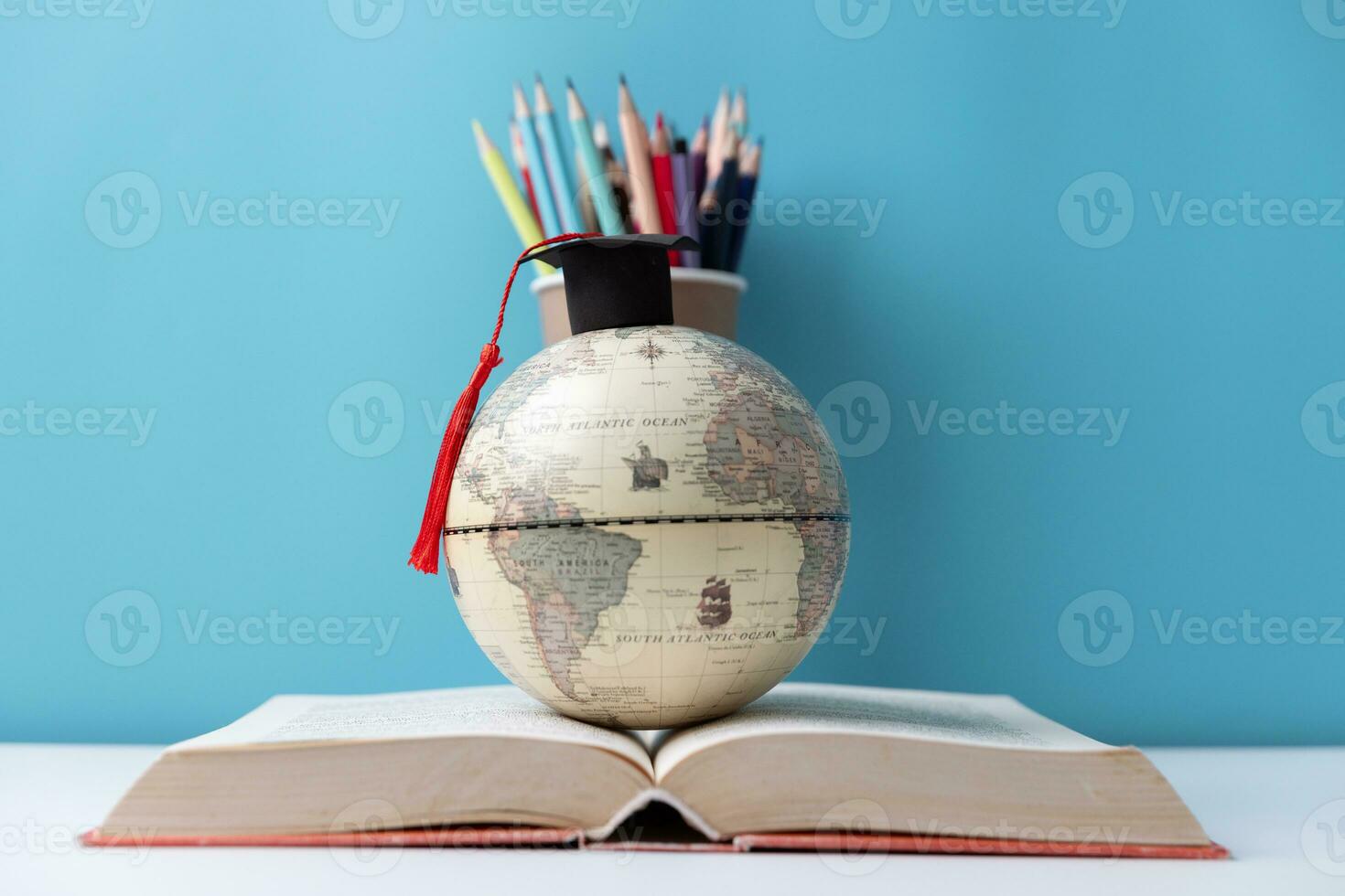 Graduation cap with Earth globe. Concept of global business study, abroad educational, Back to School, Study abroad business in universities. Elements of this image furnished by NASA. photo