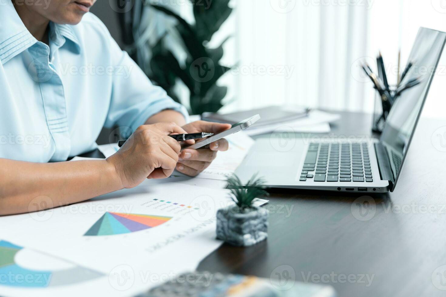 Businesswomen working to analyze, work together to discuss company financial statistics, brainstorm ideas, and graph documents on the table. photo