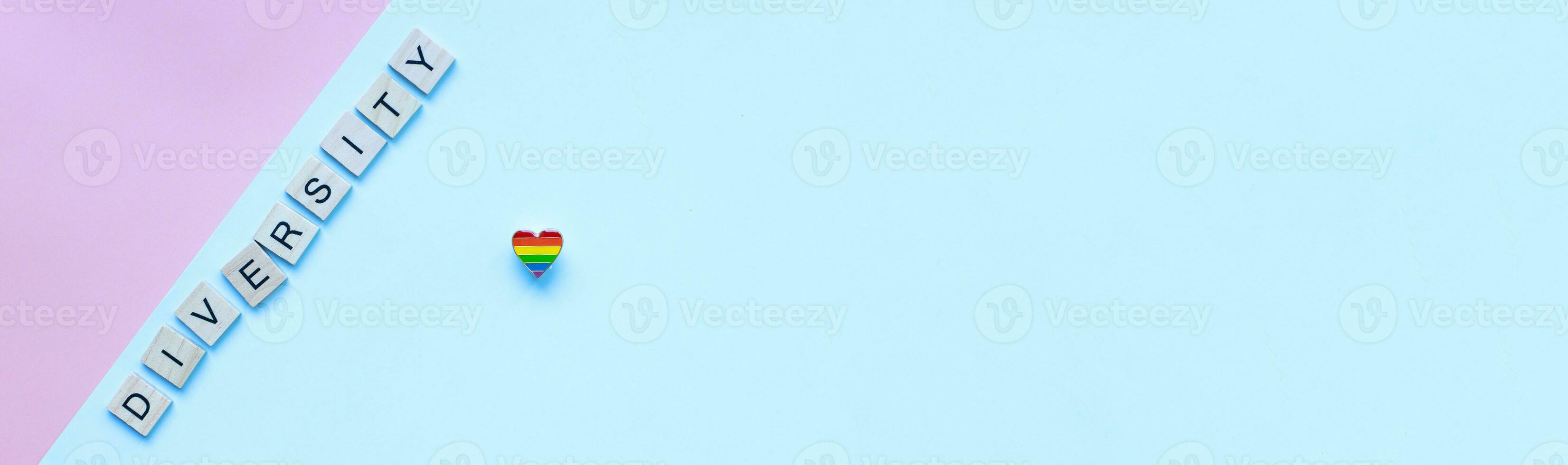 Banner Flat lay pride heart icon. LGBT. Pride month and day. Word diversity from wooden letters photo