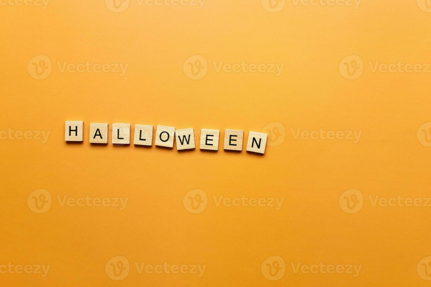 Halloween word on orange background photo