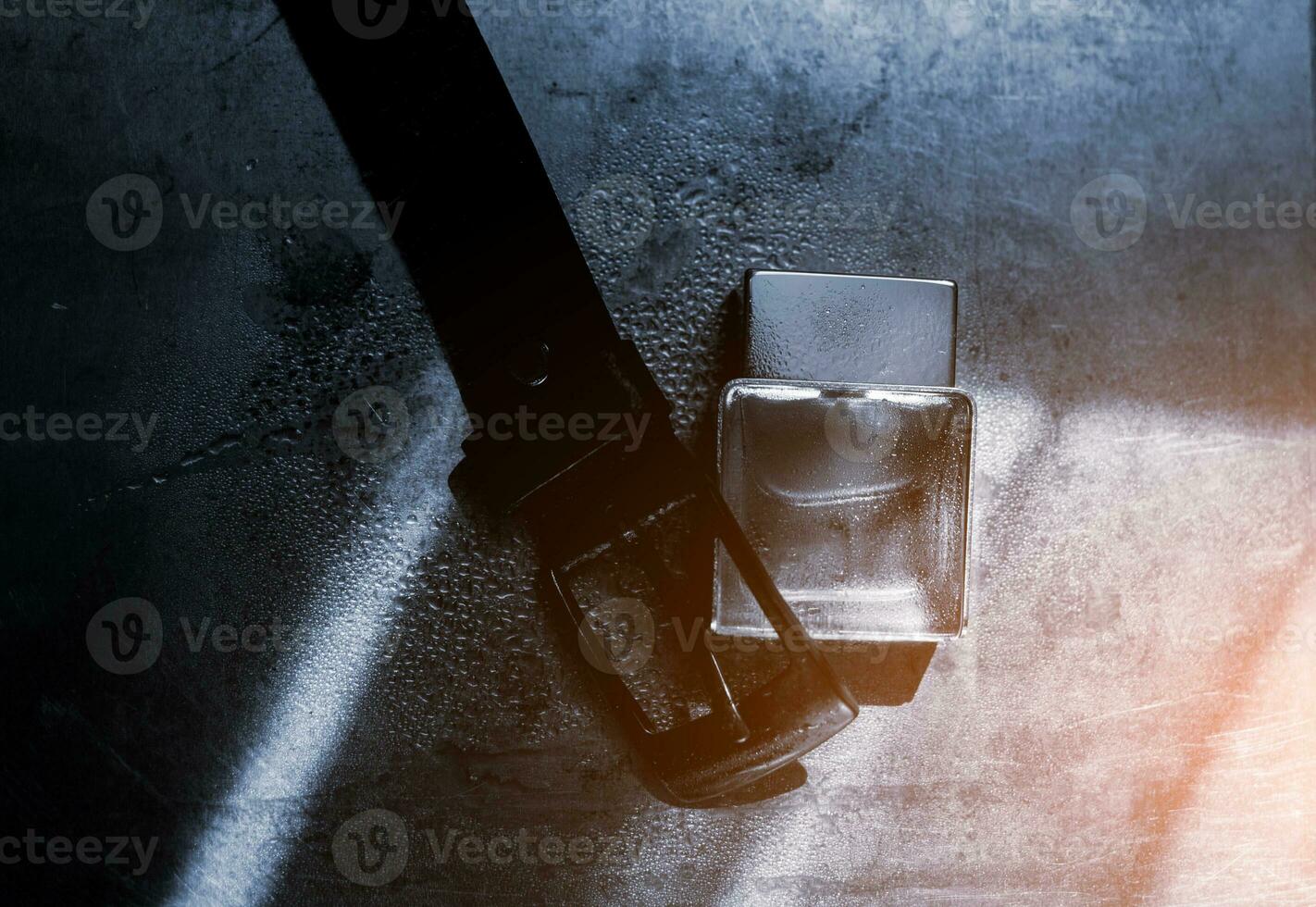 Perfume with leather belt photo