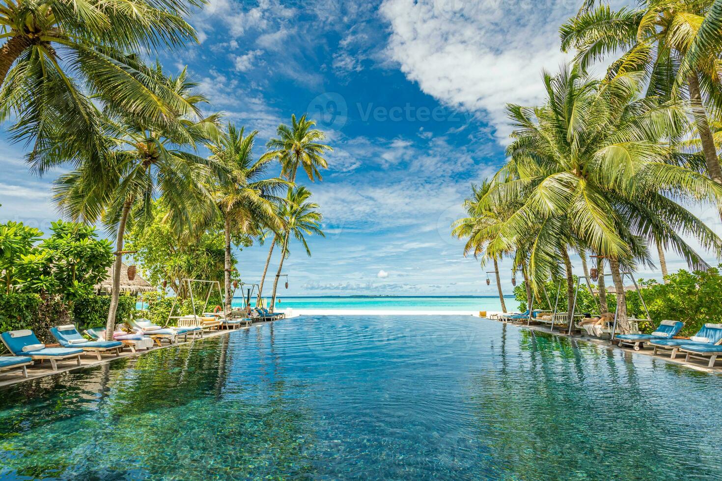 Luxury swimming pool with fantastic sea view and horizon under palm trees. Exotic beach summer vacation and holiday resort or hotel concept, family couple vacation, beach panorama tourism background photo
