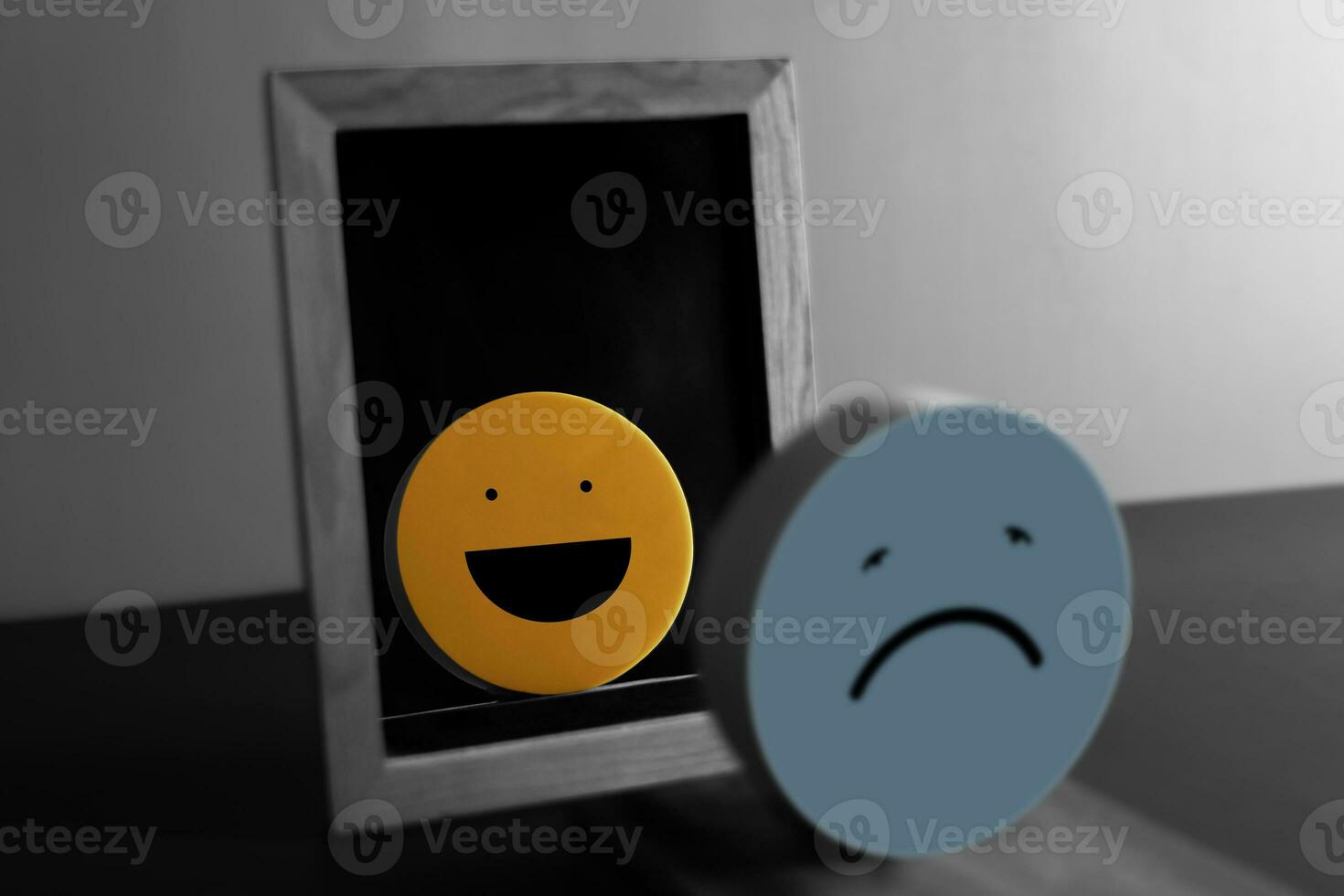 Self Love, Self Encoragement, Mental Health, Optimistic Mind Concept. Practice Yourself to be a Happiness Person. a Sad Face Reflects a Happy face on another side of the Mirror. photo