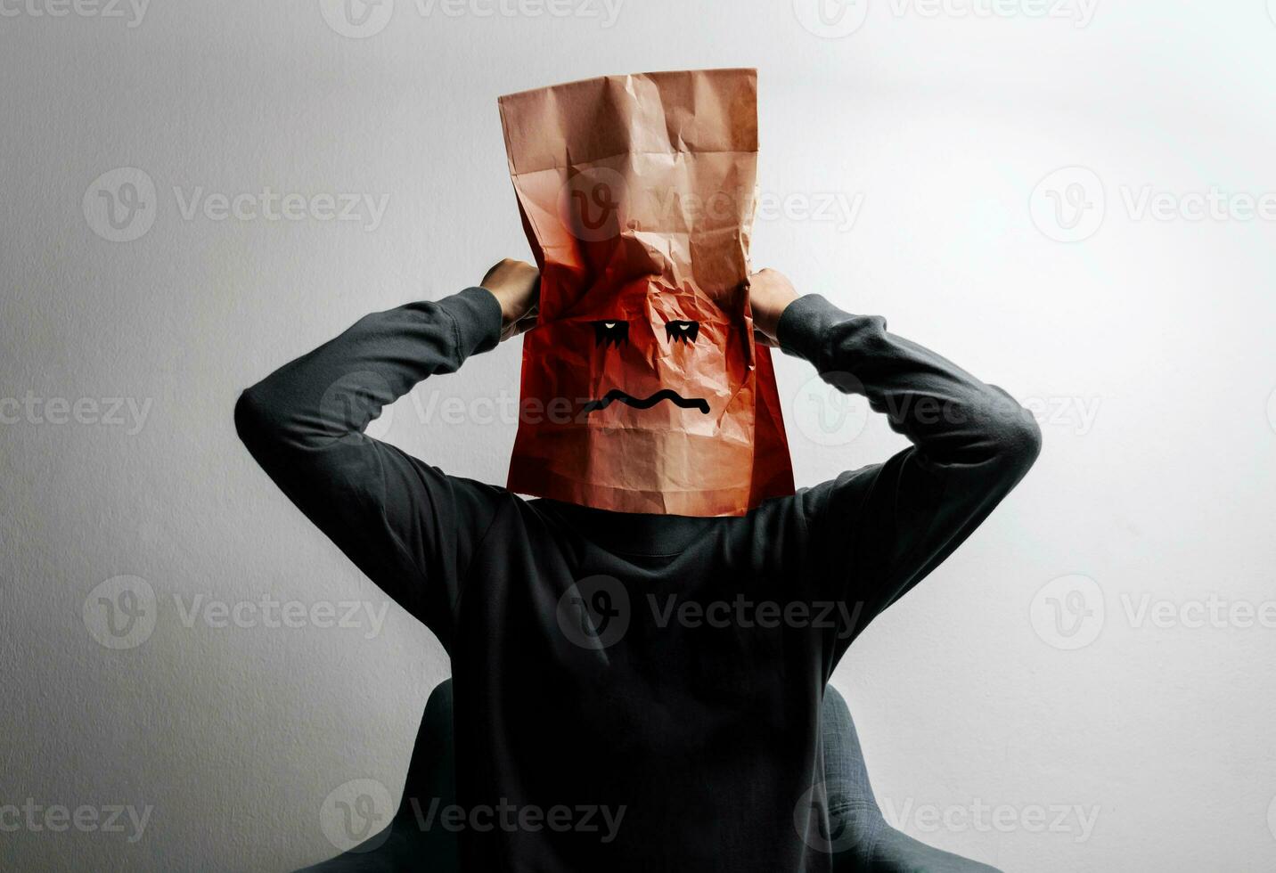 Mental Health Disorder Concept. Weak, Anxiety, Stressed Down Person. Negative Feeling. Depressed Emotional in Mind. Stessed Person covered Bag on Head. photo