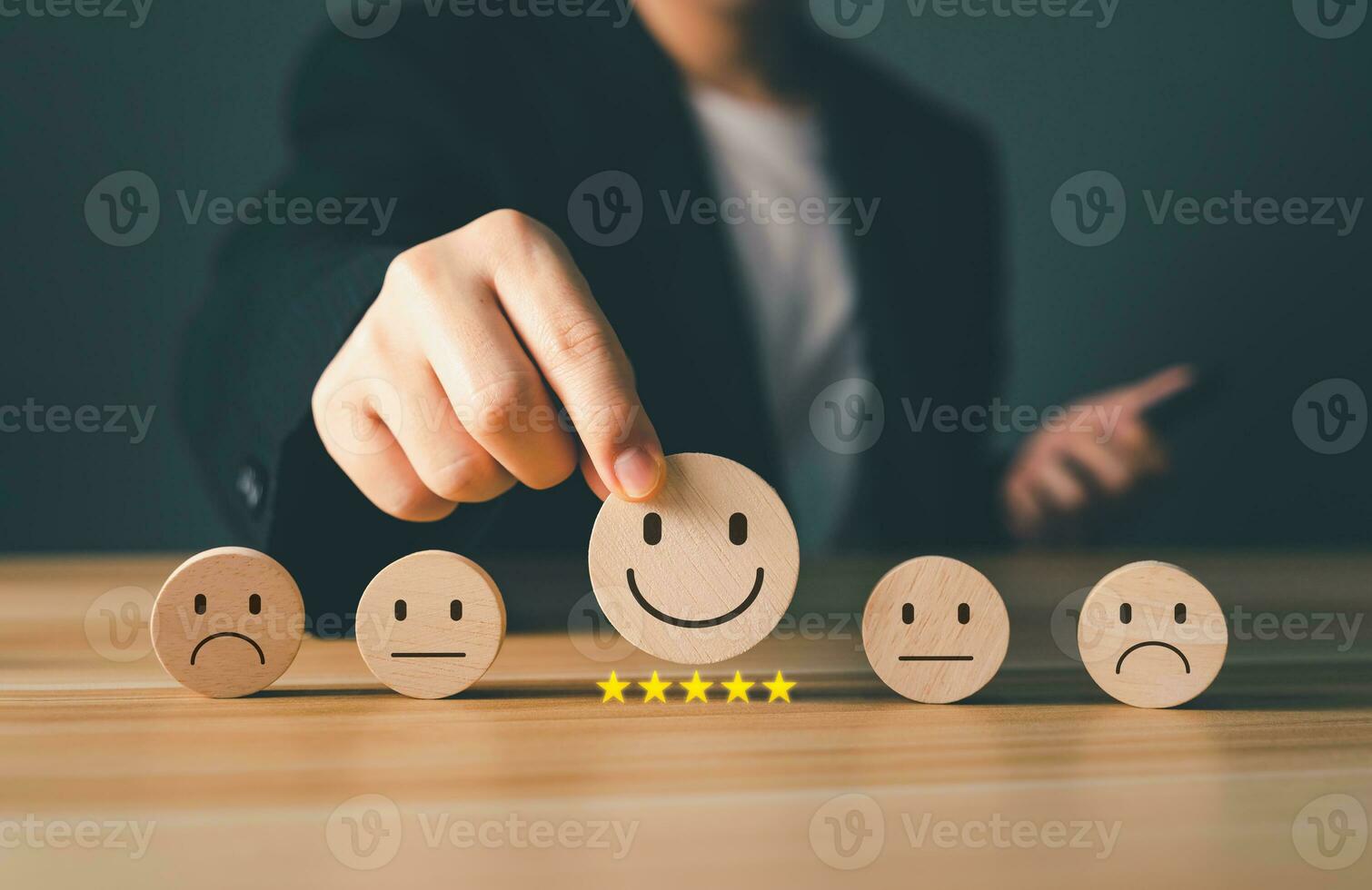 Satisfaction, Customer service, Rating concepts. Business men choose wooden block to rating customer satisfaction score and five star level, service feedback, online review, the popular service. photo