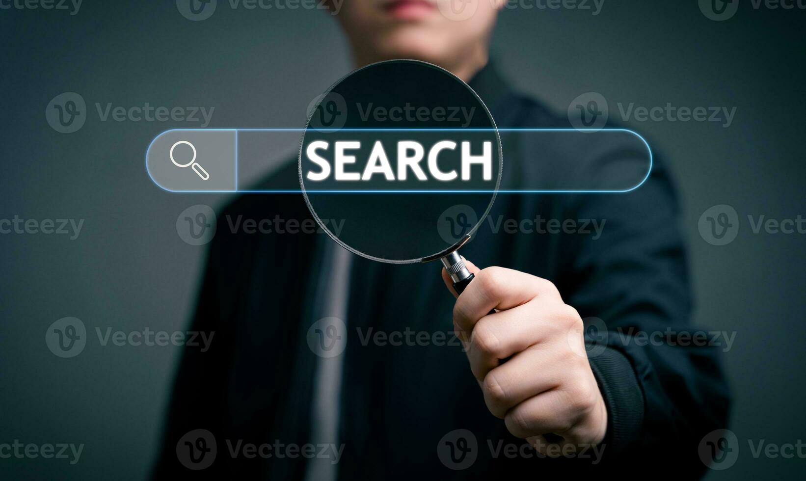 Businessman hand use magnifying glass Search for information. Using Search Console for data, info, Searching On Virtual Screen Data Search Technology Search Engine Optimization. photo