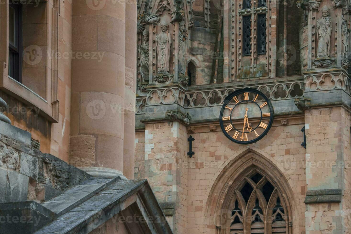 Old clock on wall of St. Mary's church in Oxford, England photo