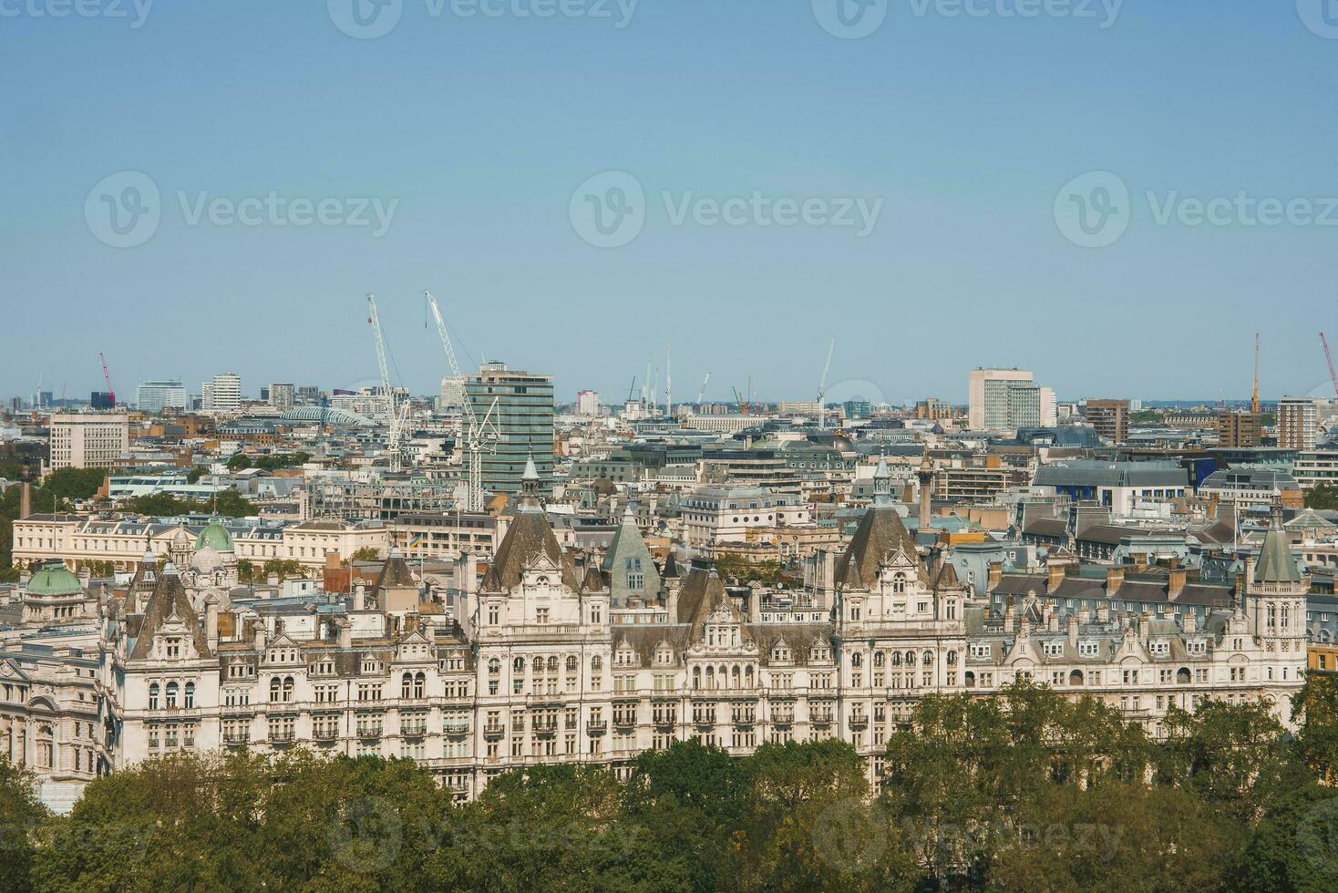 The Royal Horseguards hotel amidst buildings in city on sunny day photo