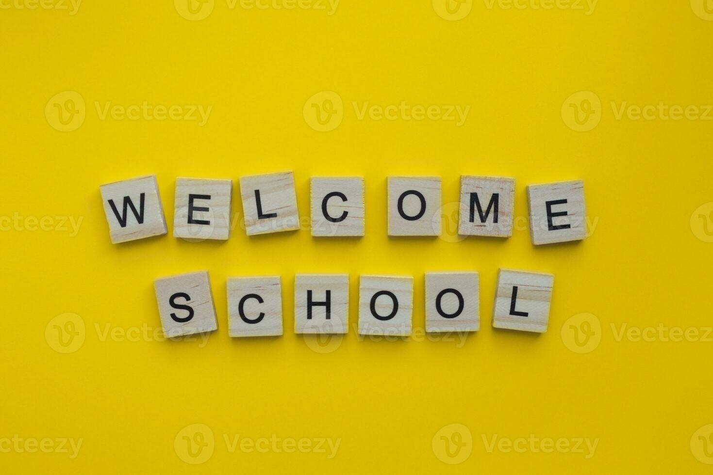 September 1, Knowledge Day, Back to school, welcome school, minimalistic banner with the inscription in wooden letters photo