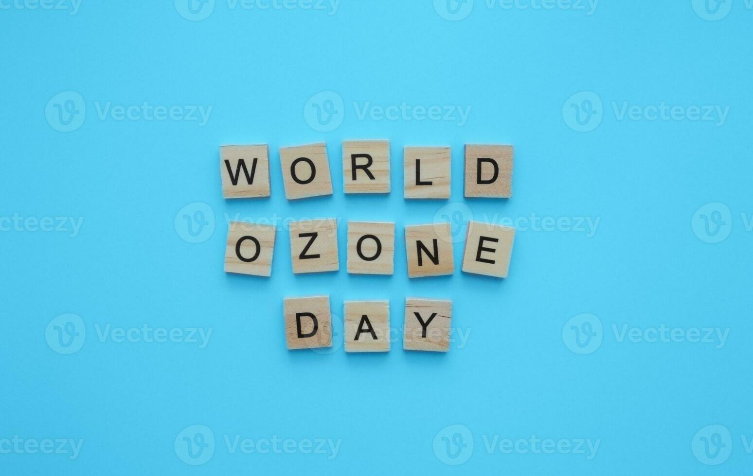 September 16, International Day for the Preservation of the Ozone Layer, World Ozone Day, minimalistic banner with the inscription in wooden letters photo