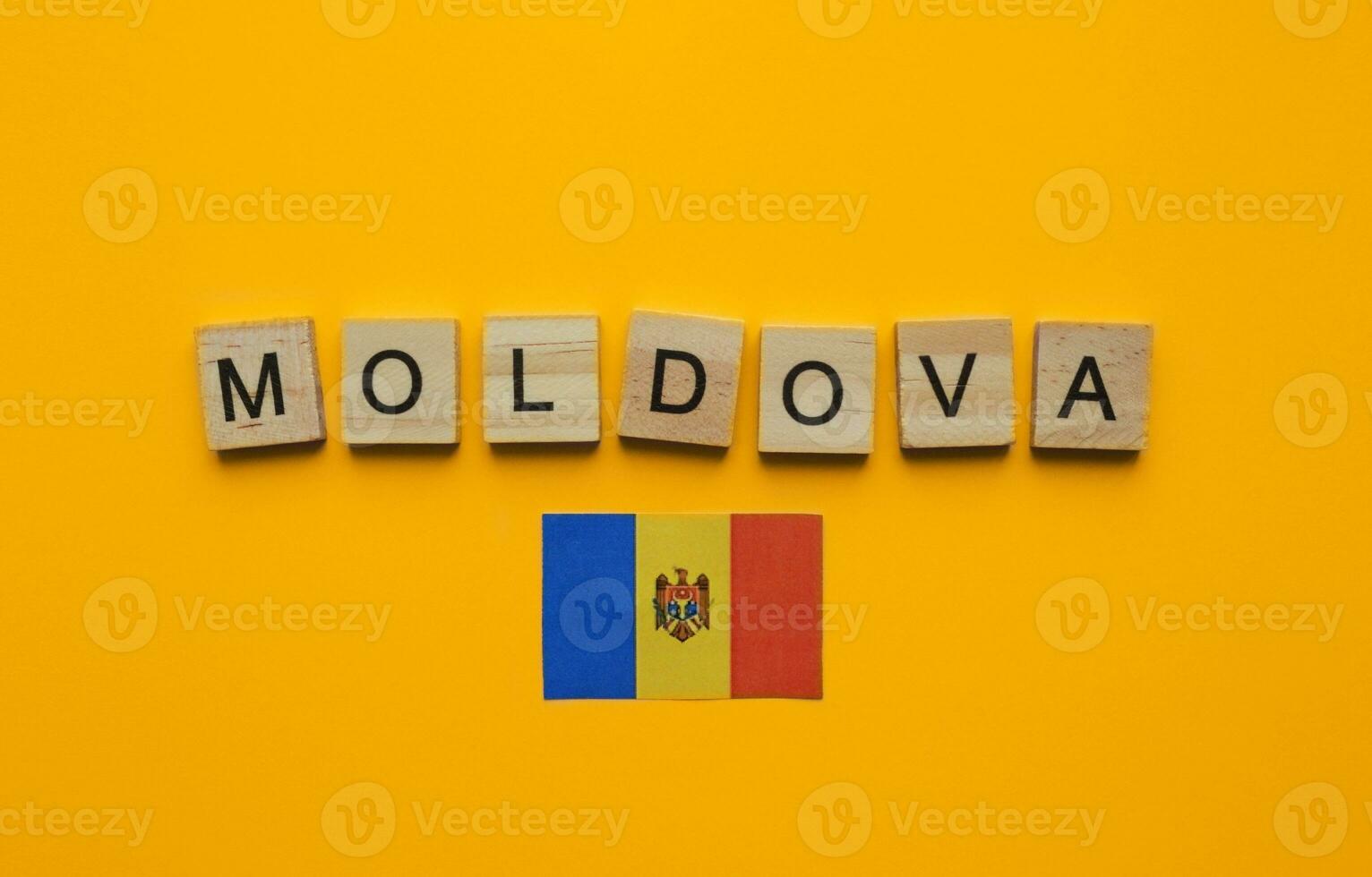August 27, Moldova Independence Day, flag of Moldova, minimalistic banner with the inscription in wooden letters photo