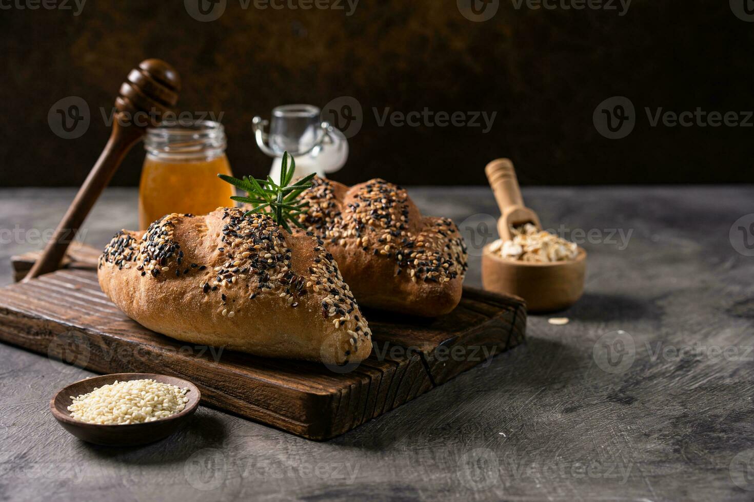 Fresh homemade bread whole wheat baguette on napkin and abstract table. Sourdough bread photo