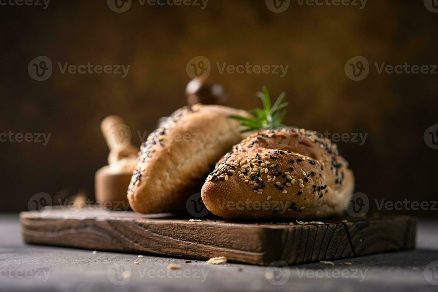 Fresh homemade bread whole wheat baguette on napkin and abstract table. Sourdough bread photo