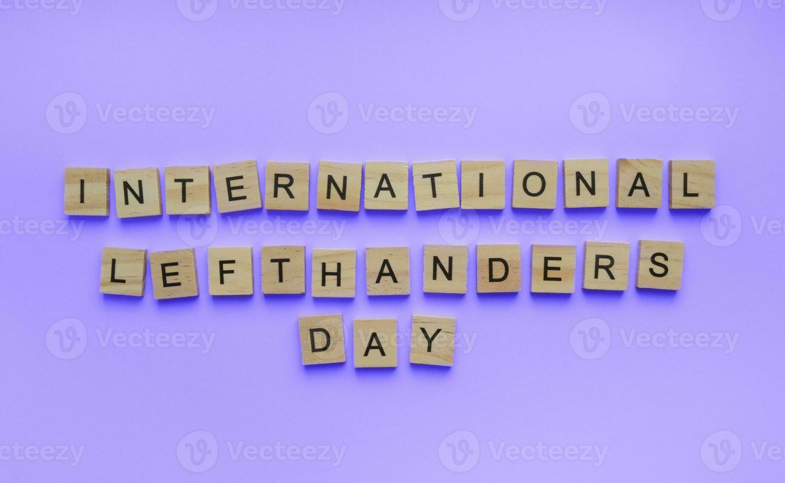 August 13, International Day of Lefties, Lefthanders Day, minimalistic banner with the inscription in wooden letters photo