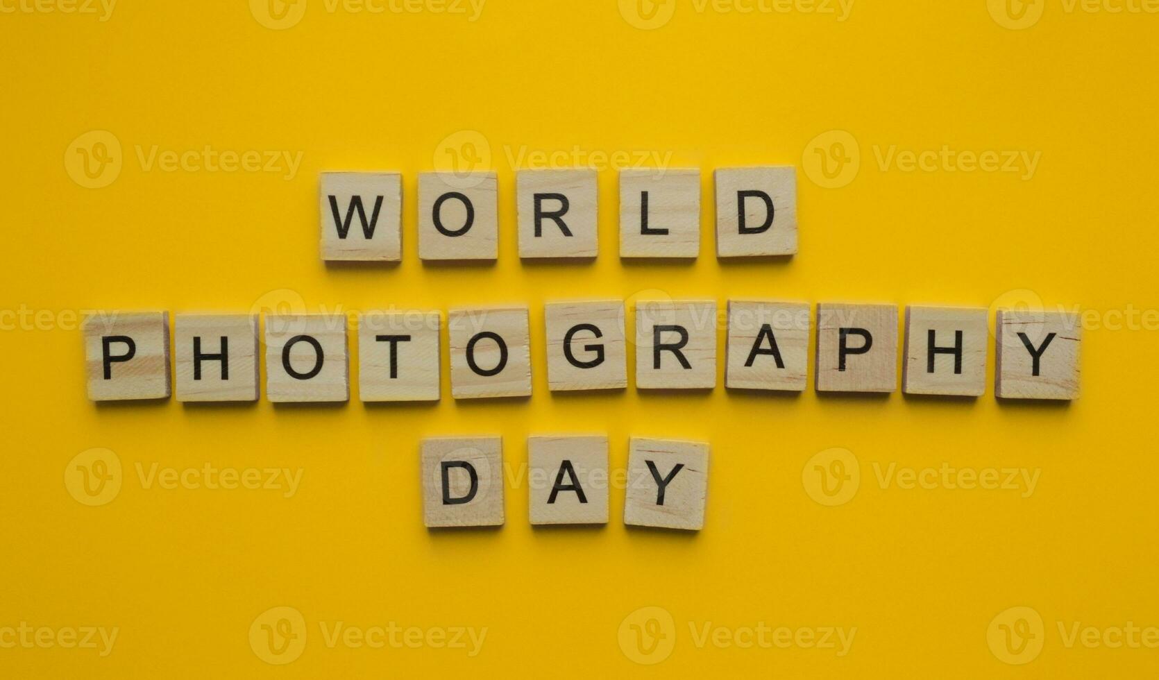 August 19, World Photography Day, minimalistic banner with the inscription in wooden letters photo