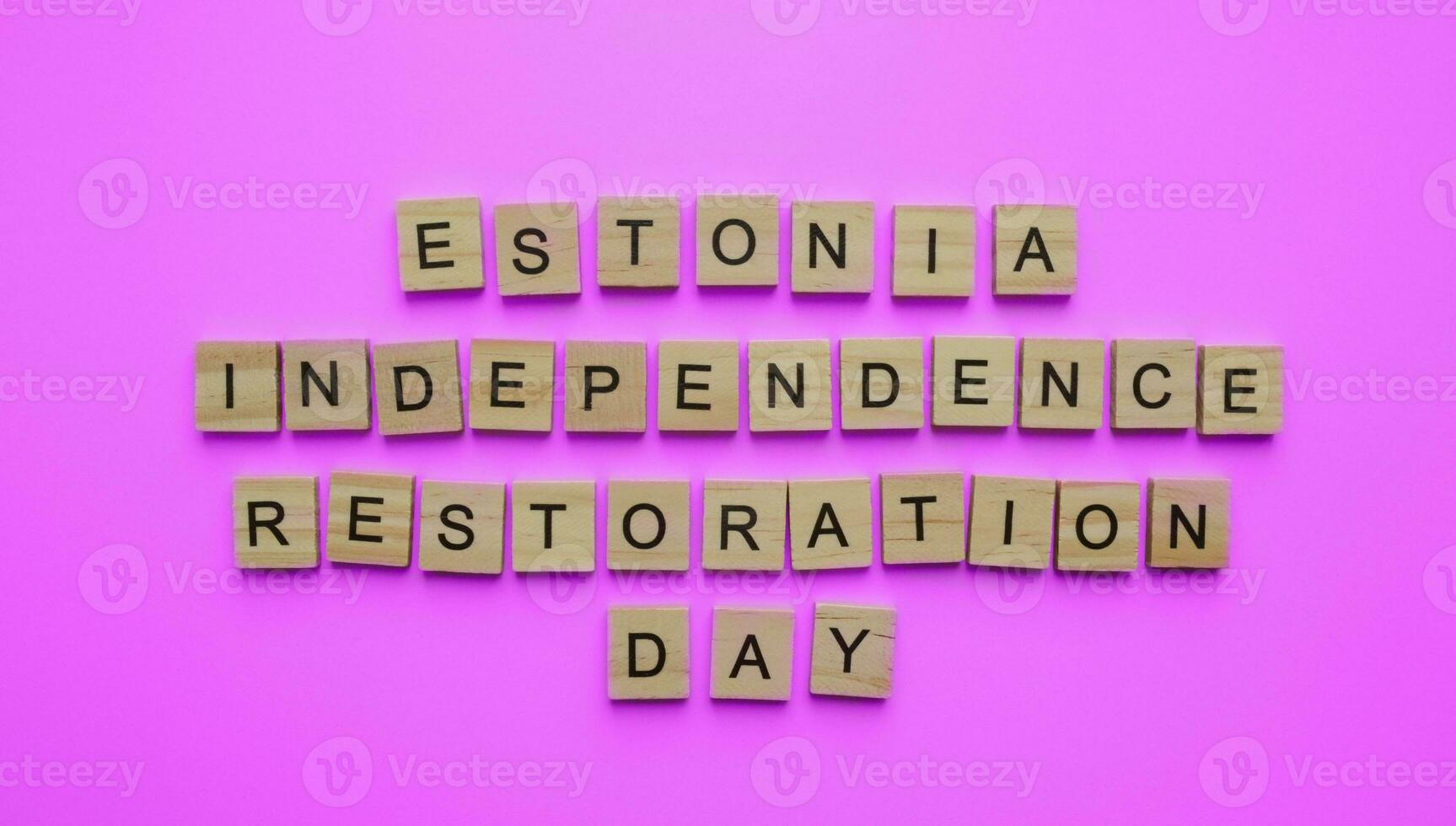 August 20, Estonia Independence Restoration Day, minimalistic banner with the inscription in wooden letters on a pink background photo