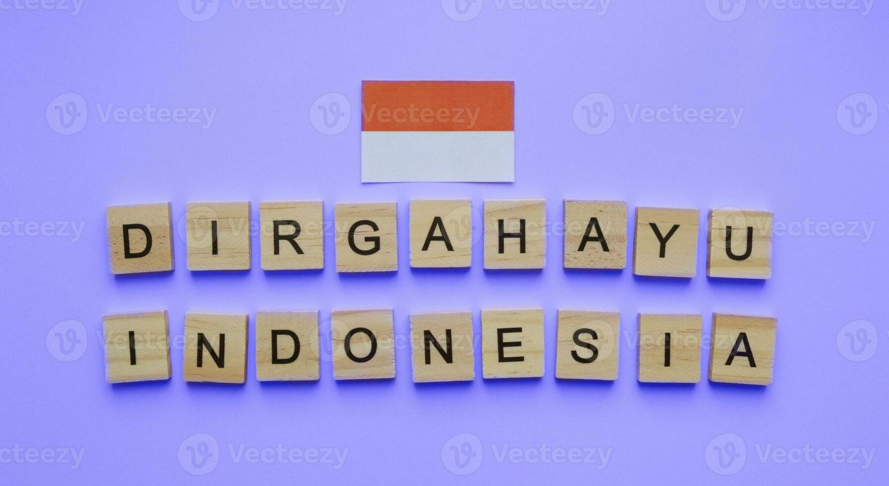 August 17, Indonesia Independence Day, flag of Indonesia, minimalistic banner with the inscription in wooden letters Dirgahayu Indonesia photo