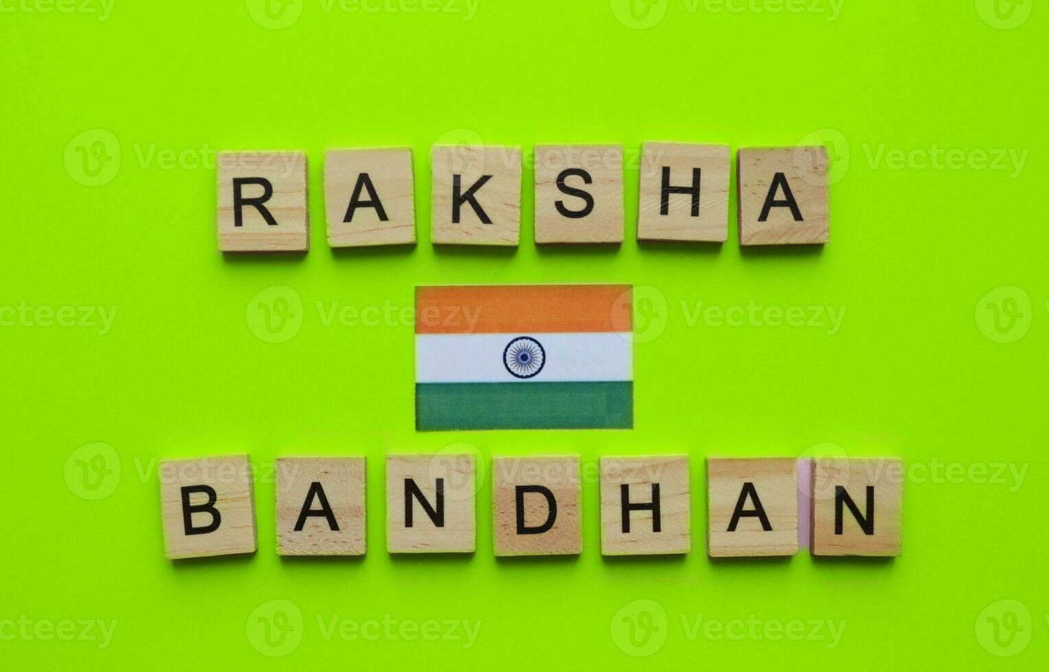 August 30, Raksha Bandhan, flag of India, minimalistic banner with the inscription in wooden letters on a green background photo