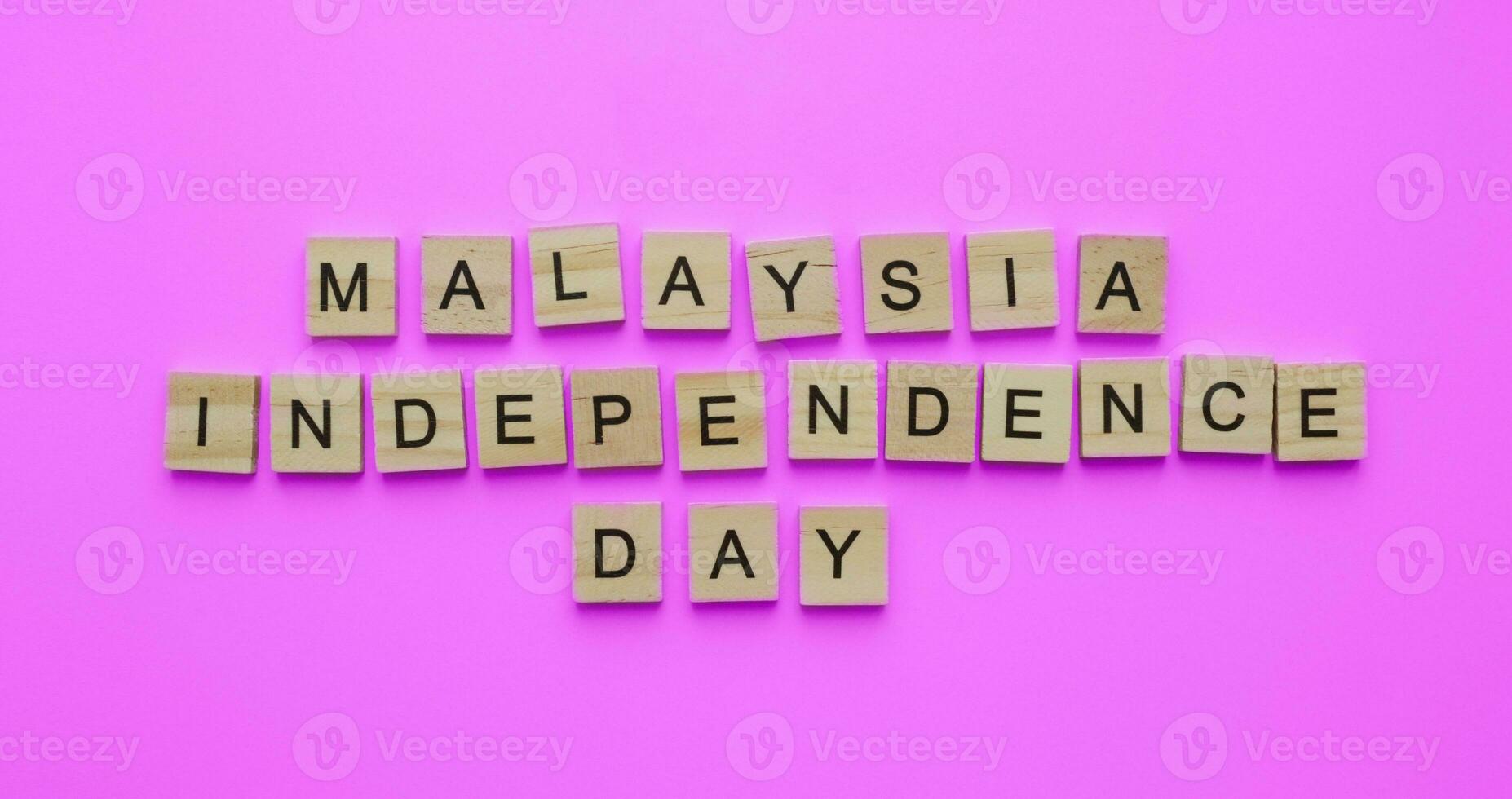 August 31, Malaysia Independence Day, Malaysia National Day, minimalistic banner with the inscription in wooden letters photo